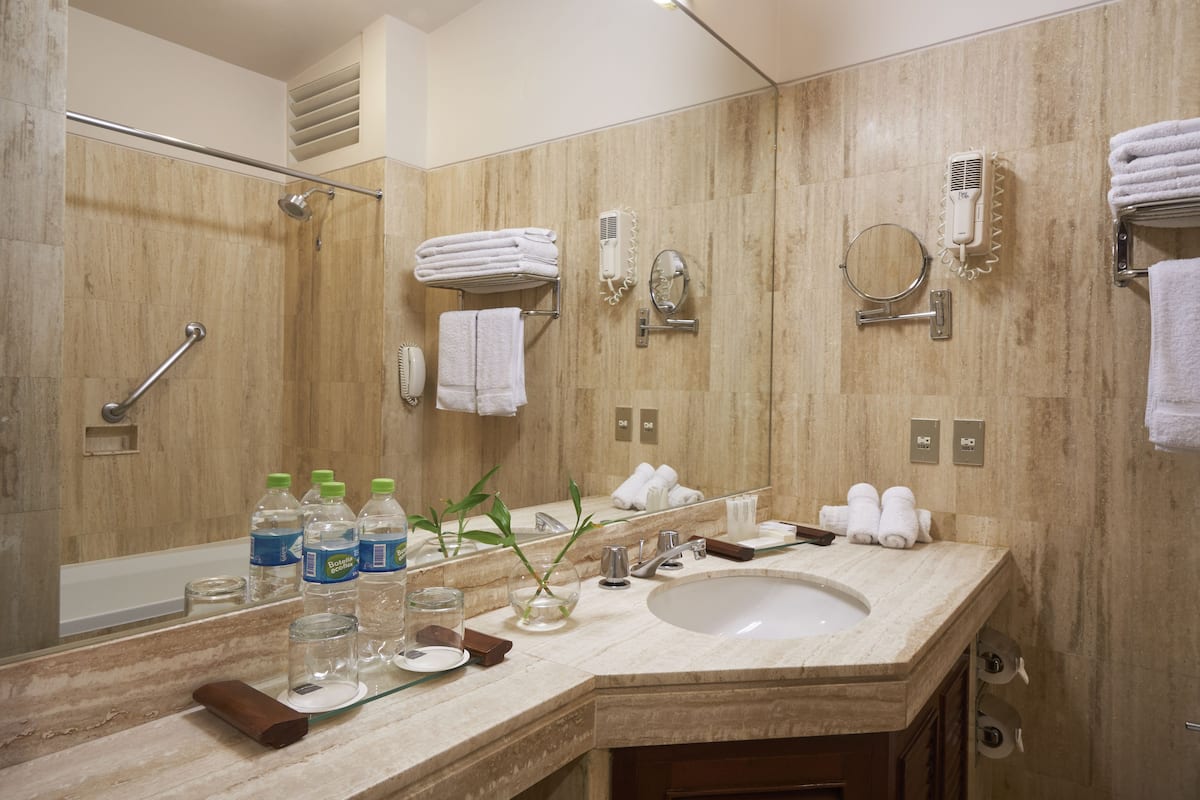 bathtub, free toiletries, hair dryer, slippers