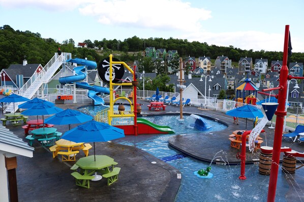 Enjoy water park fun with slides and play structures, picnic tables, and shaded areas.