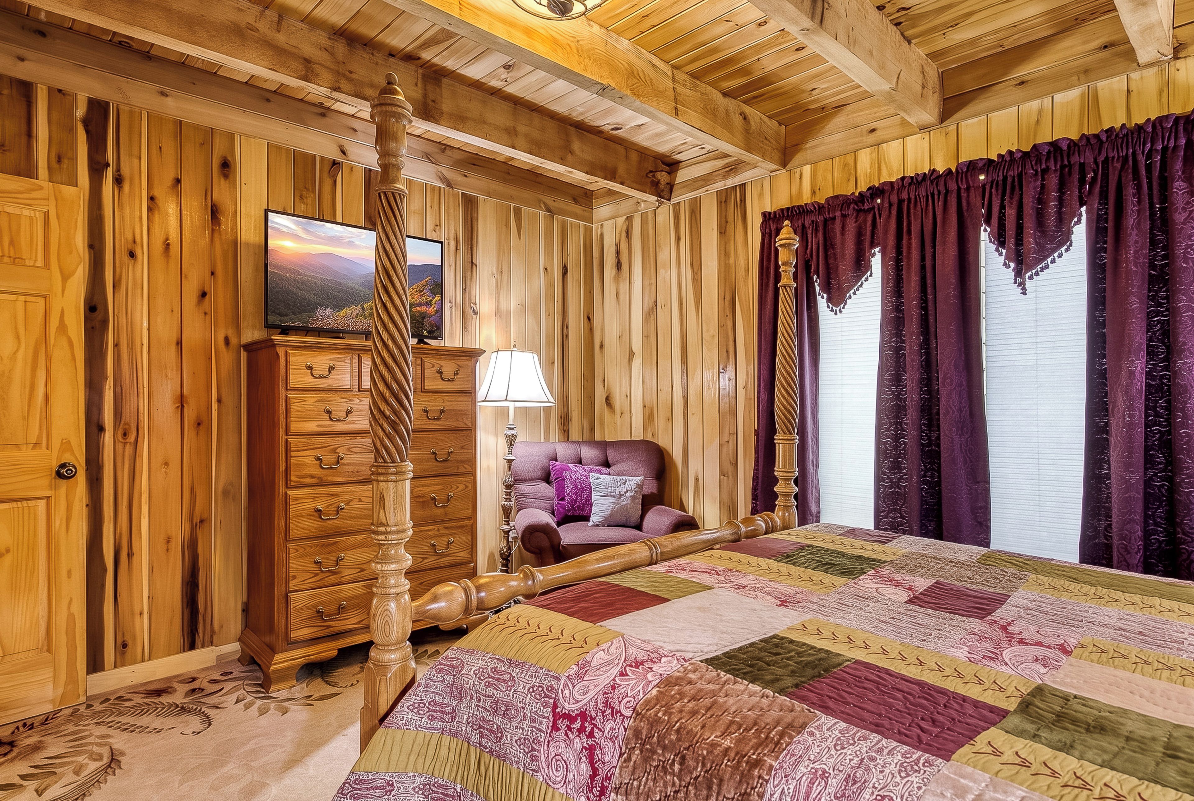 A wooden-paneled room with a bed, a dresser, a television, and a window with curtains.