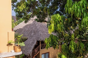 A thatched-roof structure with a staircase leading to a balcony. - Amaca Beach Retreat - Puerto Vallarta South Shore (Quimixto)