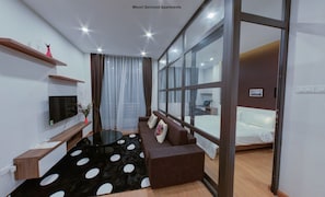 Standard Apartment, 1 Bedroom | Living room | Smart TV, fireplace