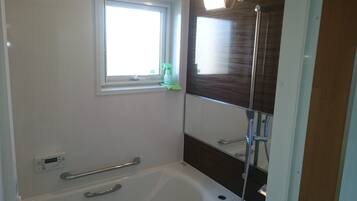 Hair dryer, slippers, towels, soap