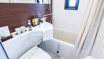 Combined shower/tub, free toiletries, hair dryer, slippers