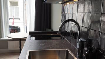 Studio (Staff) | Private kitchenette | Fridge, microwave, oven, stovetop