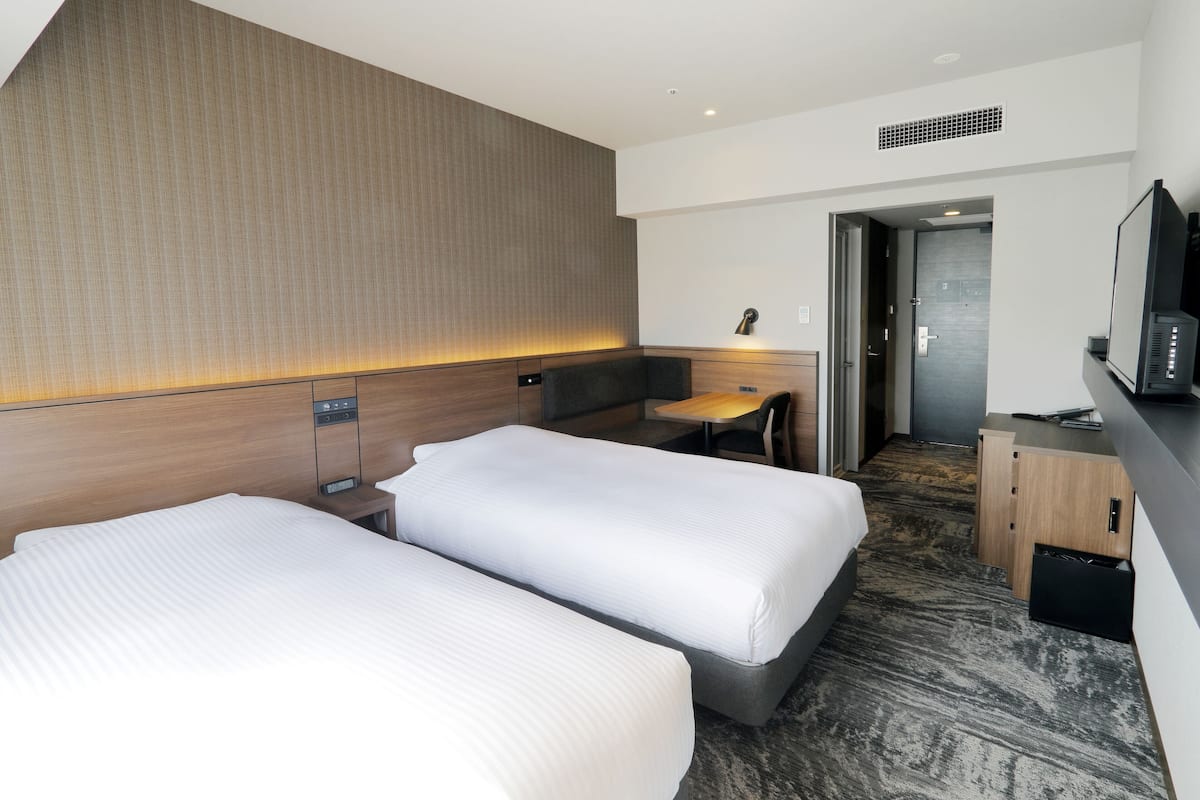 Habitación con 2 camas individuales | Ropa de cama de alta calidad, insonorización y wifi gratis