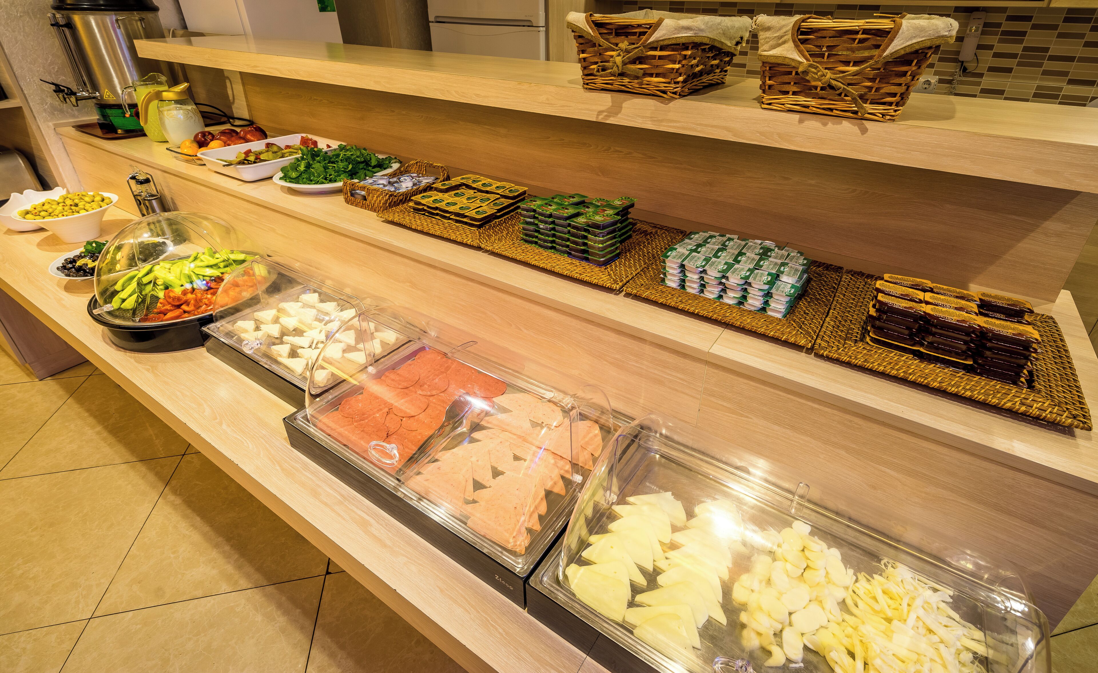 A buffet spread with various food items and condiments.
