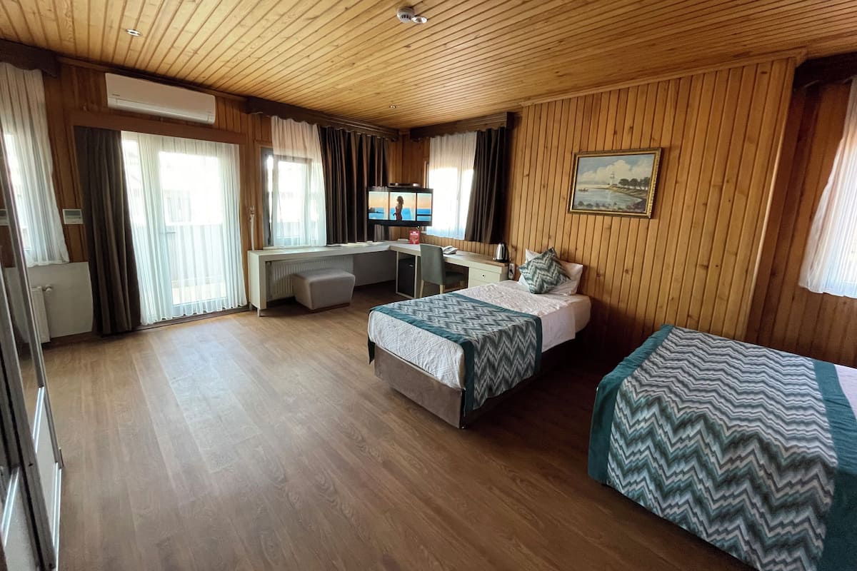 Family Room | Premium bedding, down comforters, minibar, desk
