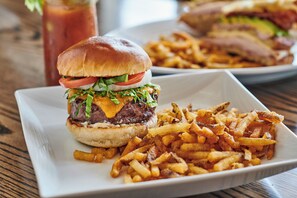 A plate with a burger and fries.