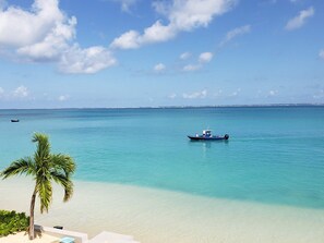 On the beach, sun-loungers, beach towels