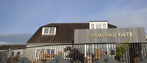 The Stamford Gate building with a clear sky.