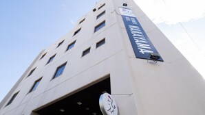A modern building with a sign for 'Hotel NAKAYAMA'. - Business Hotel Nakayama (Nagoya)