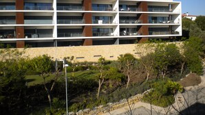 A multi-story hotel with balconies, a stone facade, and a landscaped garden area. - FABULOUS 2 BED LUXURY APARTMENT, GREAT VIEWS, MARINA VILLAGE, 120M2 (Lagos)