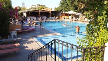 Seasonal outdoor pool, open 10:00 AM to 7:00 PM, pool umbrellas