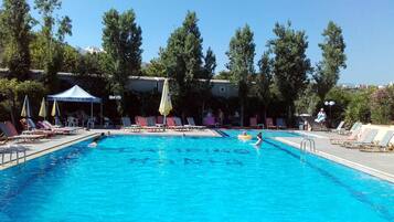Seasonal outdoor pool, open 10:00 AM to 7:00 PM, pool umbrellas