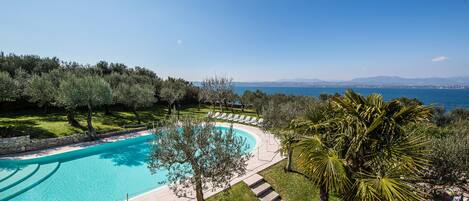 Seasonal outdoor pool, pool loungers