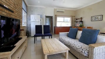 Family Suite (Penthouse) | Living area | Flat-screen TV