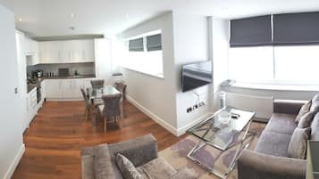 Modern two bedroom apartment | Private kitchen | Full-sized fridge, microwave, oven, stovetop