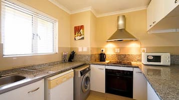 Apartment, 2 Bedrooms | Private kitchen | Fridge, microwave, stovetop, electric kettle