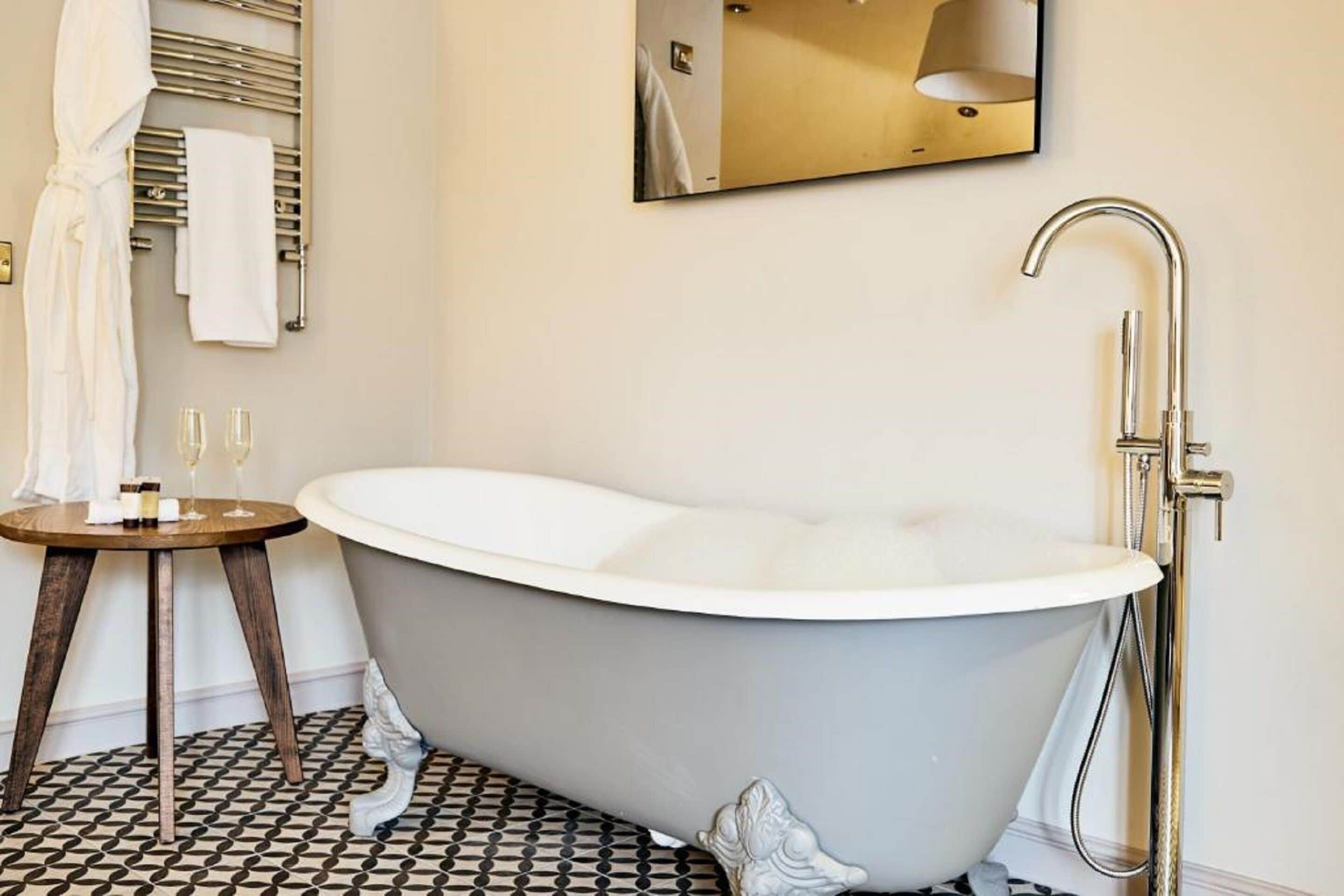 standard quadruple room | bathroom | shower, rainfall showerhead, designer toiletries, towels