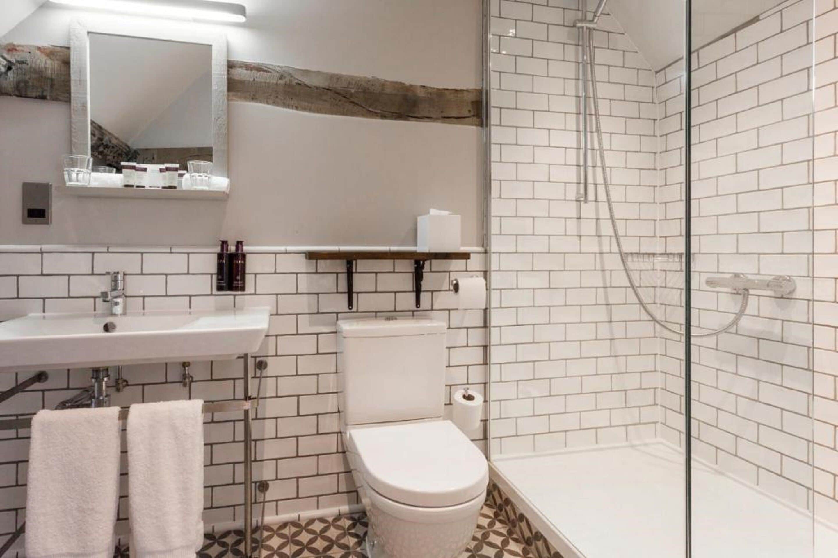 shower, rainfall showerhead, designer toiletries, towels