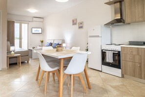 Deluxe-Apartment | Wohnbereich | Flachbildfernseher