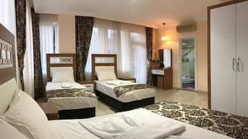 Family Room | Minibar, desk, free WiFi, bed sheets