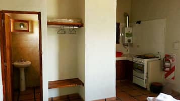 Full-size fridge, oven, stovetop, cookware/dishes/utensils