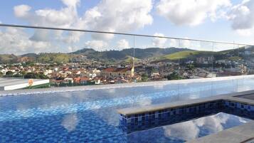 Outdoor pool, open 7:00 AM to 10:00 PM, sun loungers