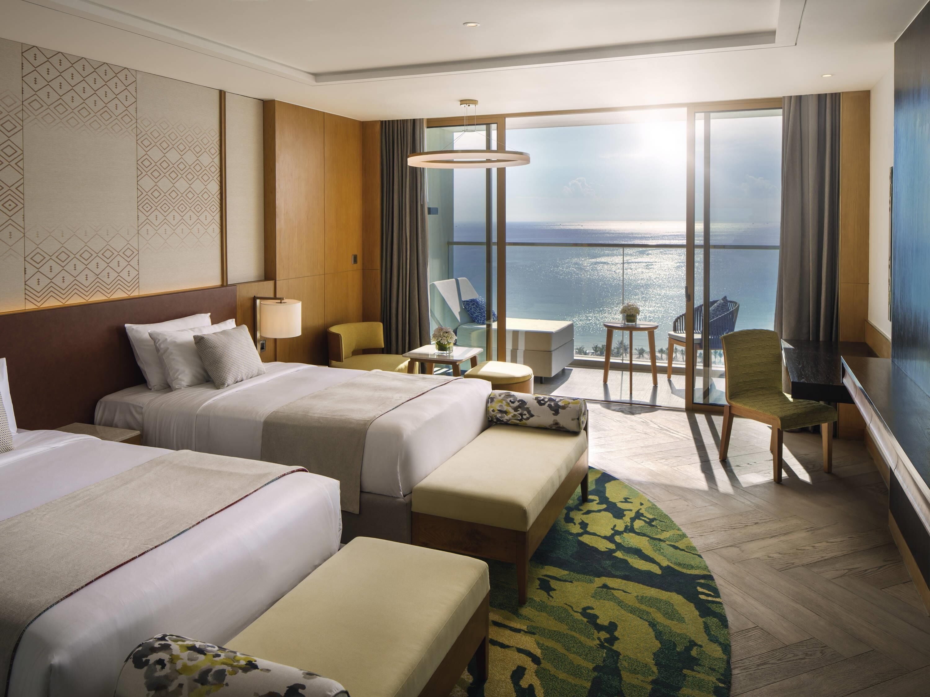 Habitación Deluxe, 2 camas individuales, vista al mar | Ropa de cama de alta calidad, edredón y minibar 