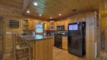Cabin | Private kitchen | Fridge, microwave, stovetop, dishwasher