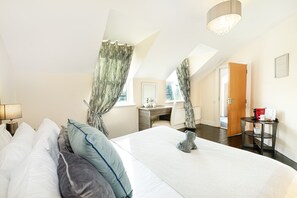 Deluxe Double Room | Hypo-allergenic bedding, desk, blackout drapes, iron/ironing board