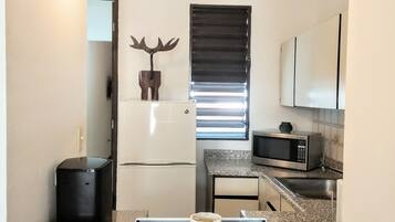 Old San Juan Apartment | Private kitchen | Fridge, microwave, paper towels