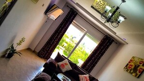 Apartment, 2 Bedrooms, Ground Floor | Living area | 40-inch Smart TV with satellite channels, TV - Family Confort Saidia 2 (Saidia)