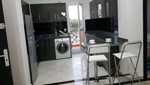 Apartment, 2 Bedrooms, 2 Bathrooms | Private kitchen | Coffee/tea maker, full-sized fridge, oven, stovetop - Family Confort Saidia 2 (Saidia)