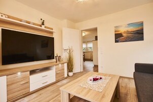 Exclusive Penthouse (Suite) | Living room | 75-inch Smart TV with satellite channels