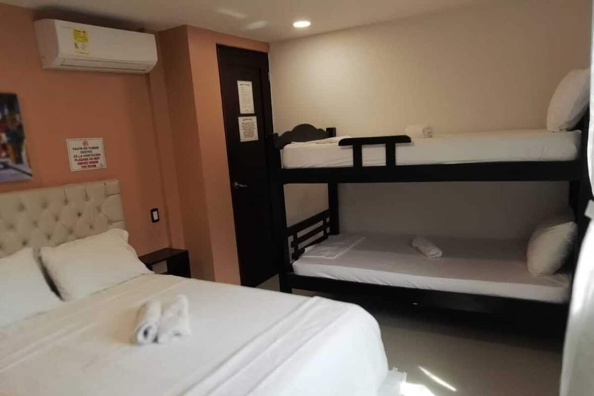 Family Quadruple Room, Balcony, City View | Peralatan tempat tidur premium, peti besi dalam bilik, Wi-fi percuma 