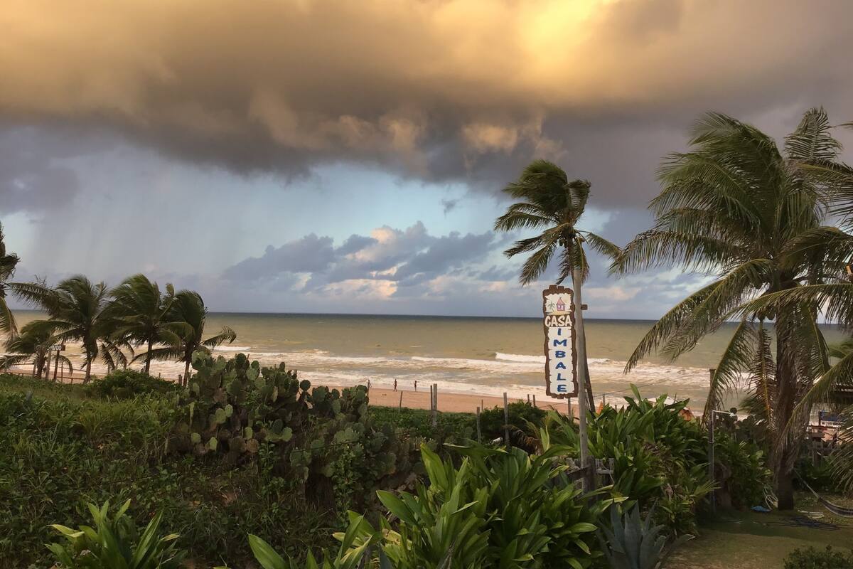 A beach view with a sign reading "CASA IMBALA".