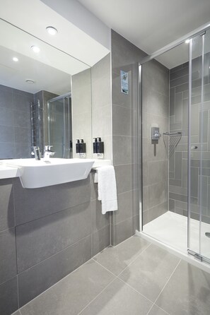 Shower, rainfall showerhead, designer toiletries, hair dryer