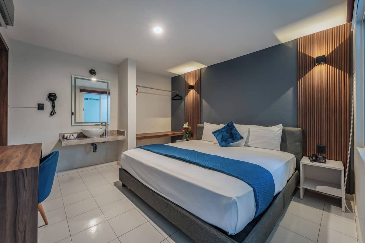 Hypo-allergenic bedding available, in-room safe, desk, laptop workspace