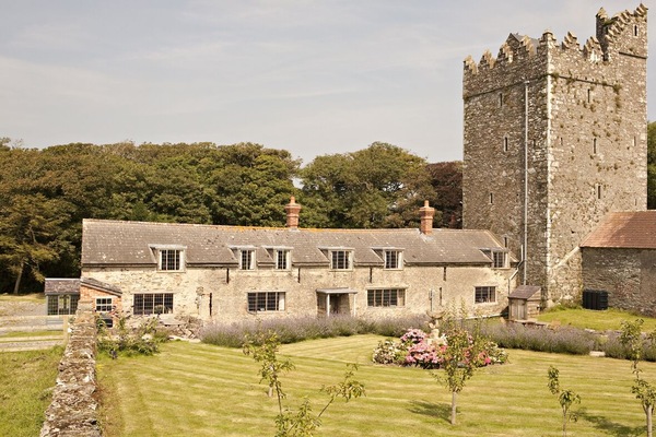 Boxwell Cottage on the left half of the long building with sun porch entrance