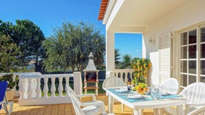 An outdoor patio with white furniture, a grill, and a view of the garden. - Villa Licinia - Three Bedroom Villa, Sleeps 6 (Guia)