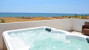 A hot tub with a view of the beach and ocean. - Imagine Your Family Renting a Luxury Holiday Villa Close to Sotira’ Main Attractions (Sotira)