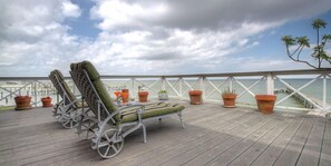 Terrace/patio - La Petit Maison, is a waterfront two-story cottage near Kemah,TX (BAYVIEW)