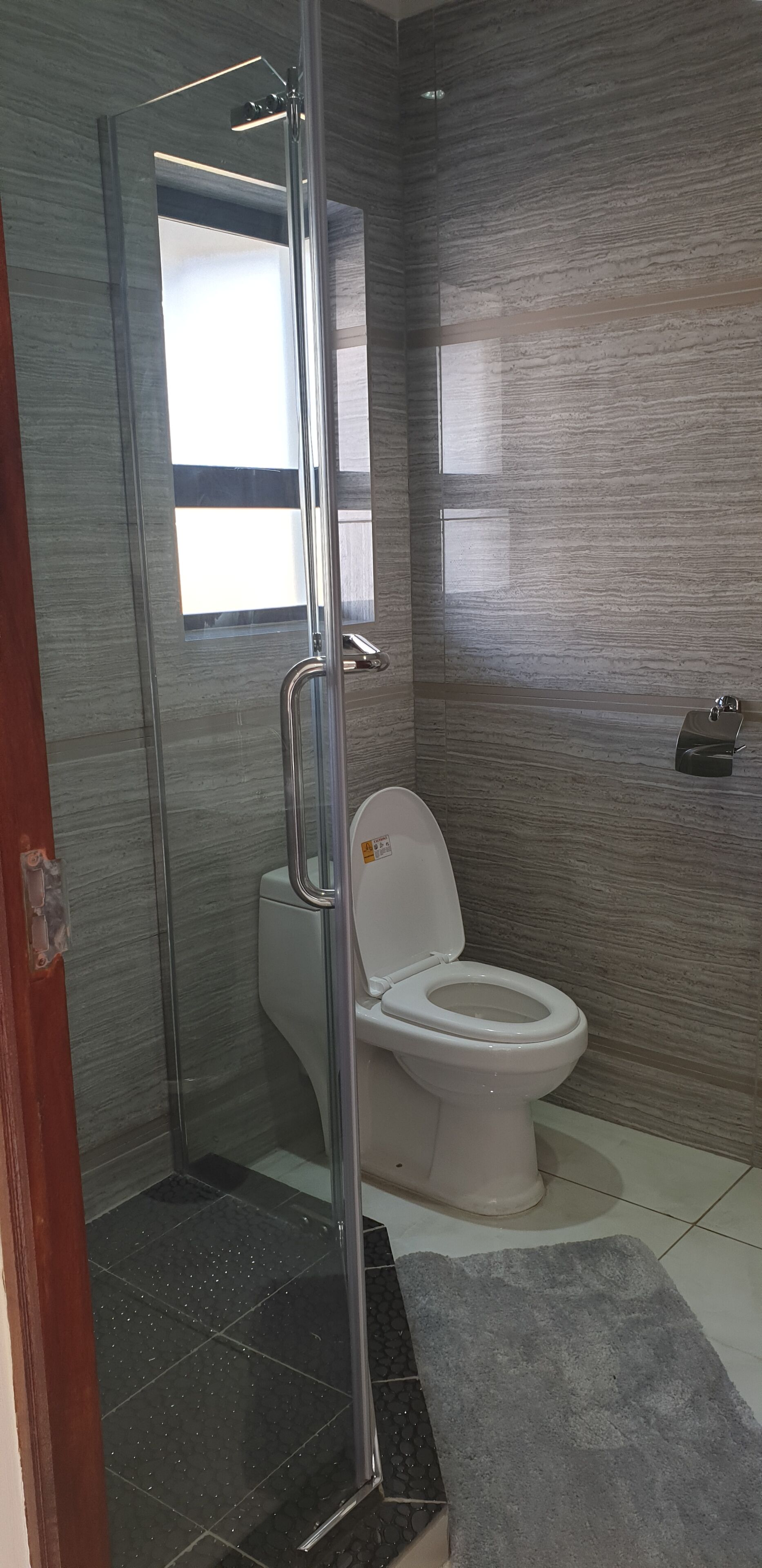 Shower, hair dryer, towels, toilet paper