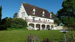 A large, white, two-story house with a balcony and multiple windows. - Holiday Home in Blis et Born, Near  Perigueux, Dordogne - Large Heated Swimming (Bassillac Et Auberoche)