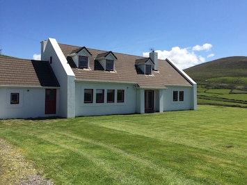 The house sits in half an acre of grounds, all laid out in grass