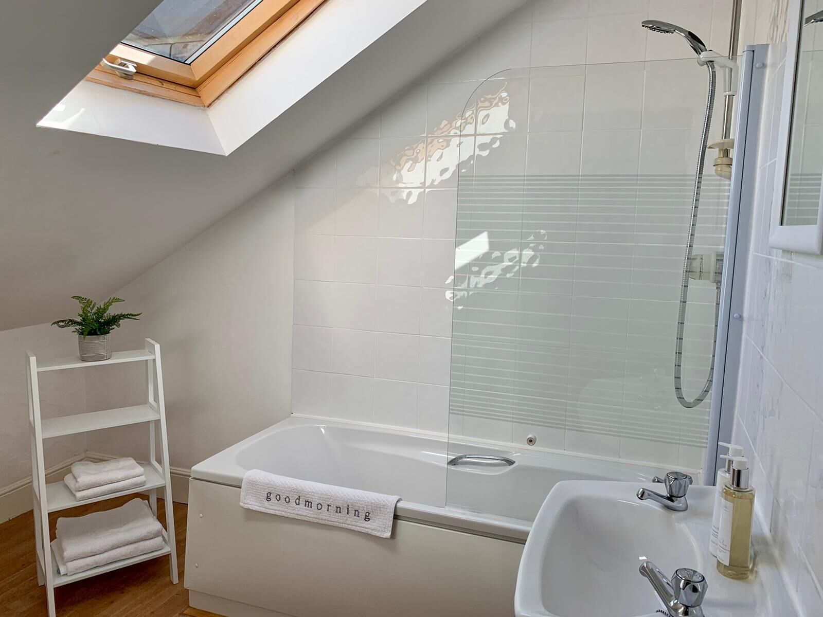 Combined shower/bathtub, hair dryer, towels, soap