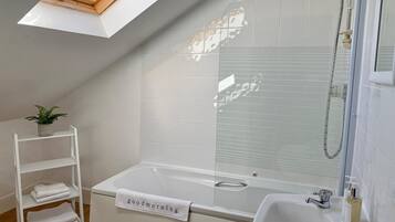 Combined shower/bathtub, hair dryer, towels, soap