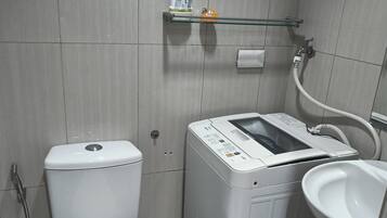 Shower, hair dryer, bidet, towels
