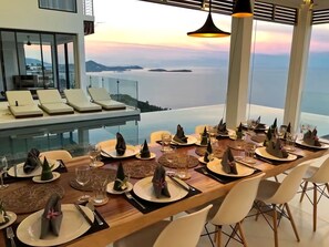 Enjoy a meal with a breathtaking view of the sea and distant islands from this elevated dining area.